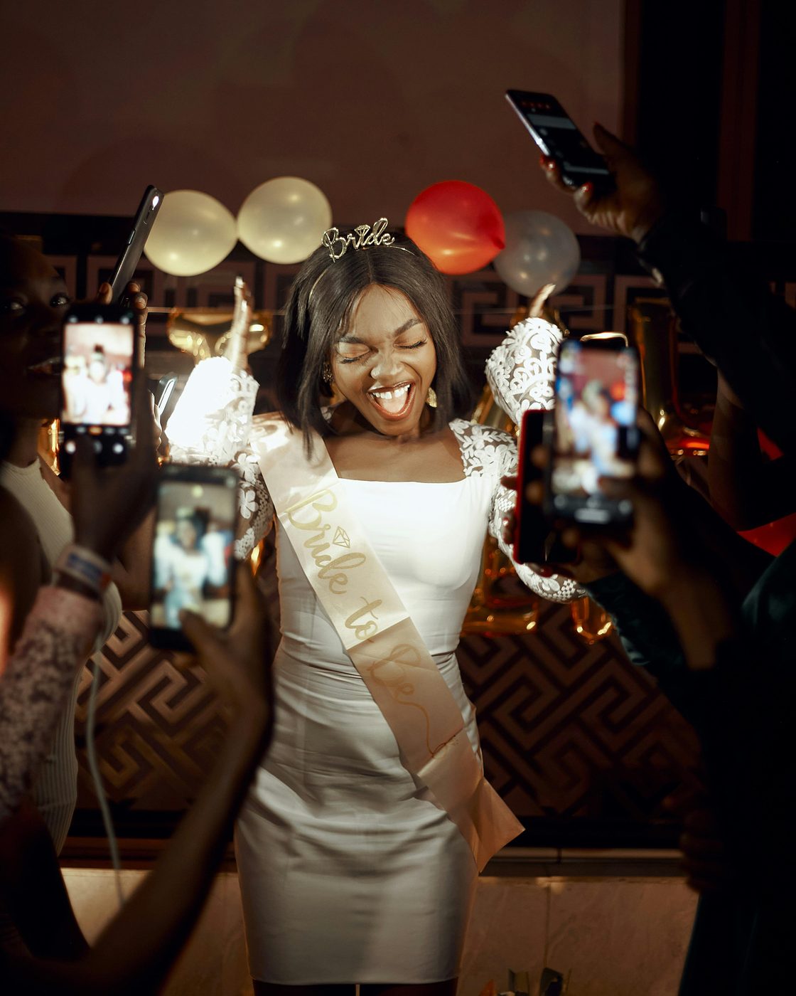 A bride celebrated at her bachelorette party with friends taking photos